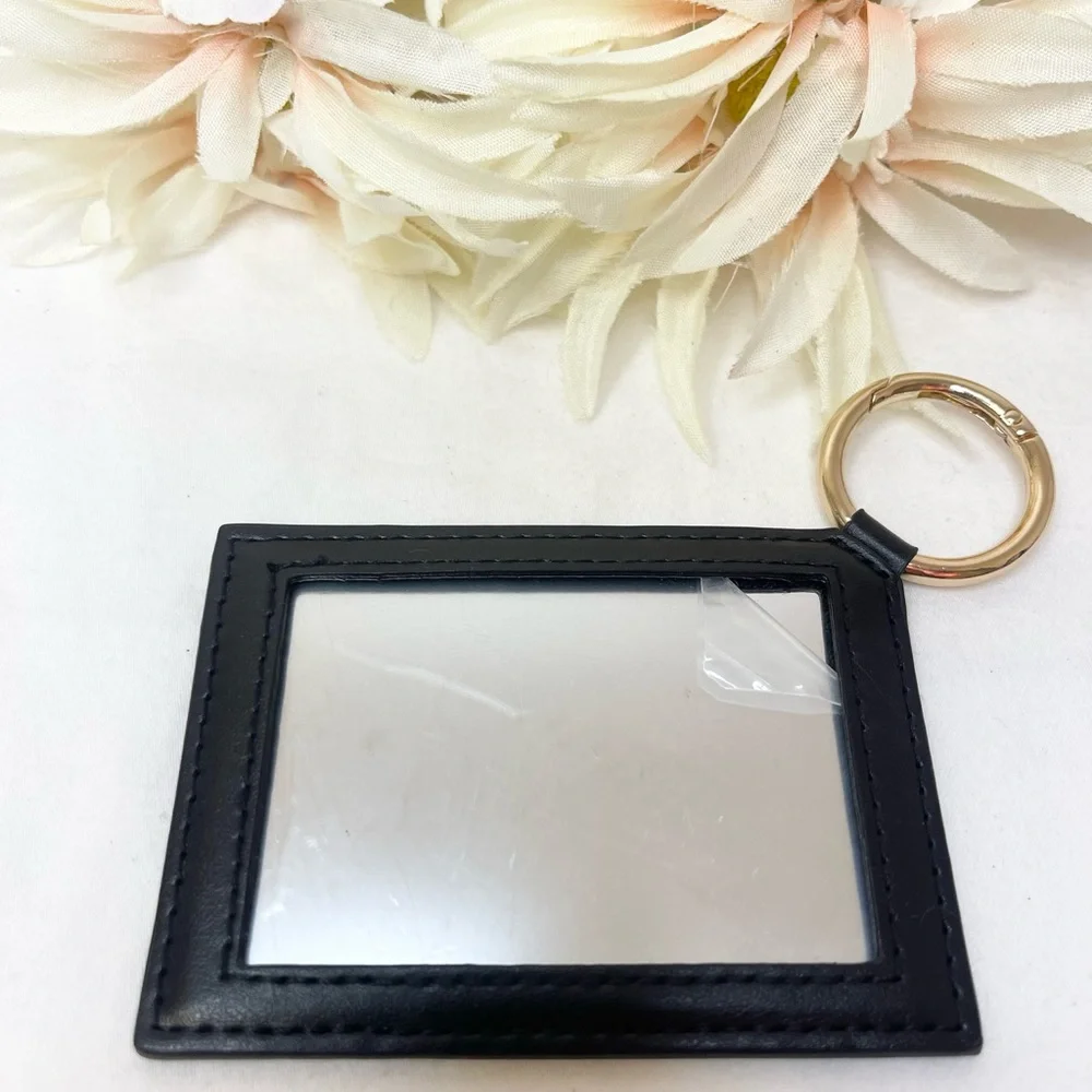 Yves Saint Laurent Black Star-Patterned Key Holder/Mirror GWP